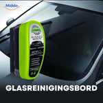 Driver using ClearView sponge to clean car windshield for streak-free results.
