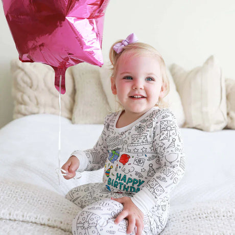 Birthday-themed coloring pajama for kids featuring fun balloon designs.