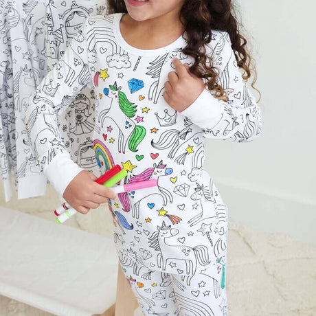 Unicorn-theme color-your-own pajama being colored by child.