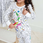 Unicorn-theme color-your-own pajama being colored by child.