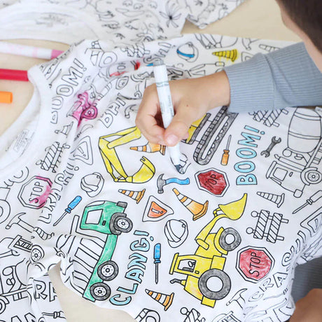 Vehicle-theme color-your-own pajama being colored by boy.