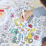 Vehicle-theme color-your-own pajama being colored by boy.