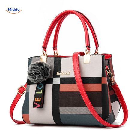 Colorful floral design spacious tote with decorative pom-pom.