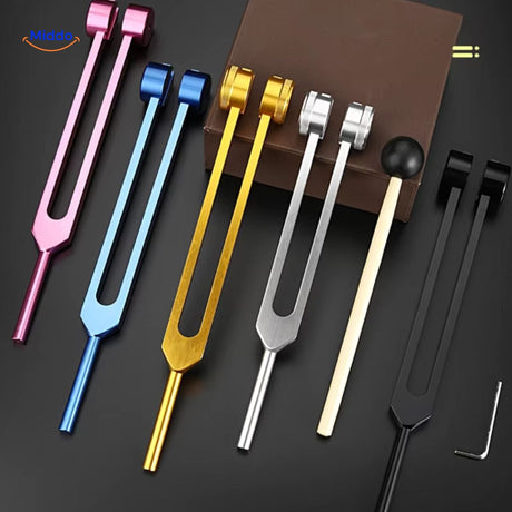 Colorful healing tuning fork set with complete therapeutic accessories.