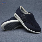 Navy blue therapeutic shoes with secure velcro strap support.