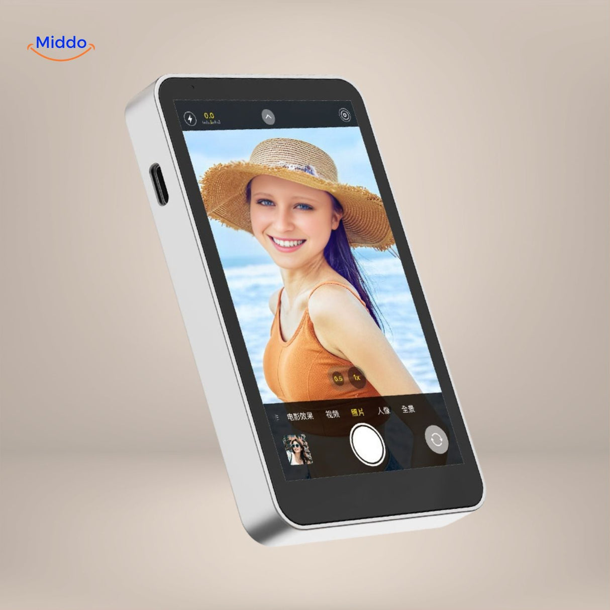 Compact MagnoScreen selfie monitor mounted on phone at beach.