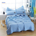 Lightweight cooling blanket in blue color displaying versatile summer option.