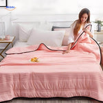 Close-up of lightweight cooling blanket texture highlighting breathable fabric.