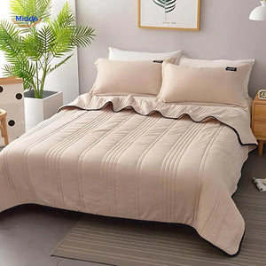 Lightweight cooling blanket in jade green creating soothing bedroom aesthetic.