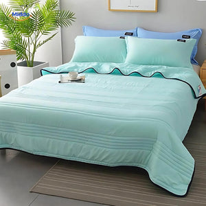 Lightweight cooling blanket in light blue perfect for summer sleep comfort.
