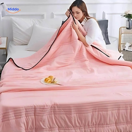 Cooling blanket in light pink showcasing breathable lightweight summer design.