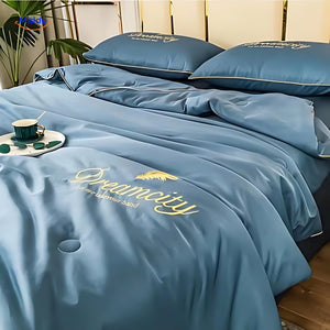 DreamCity cooling blanket draped on bed, showing actual use and premium appearance.