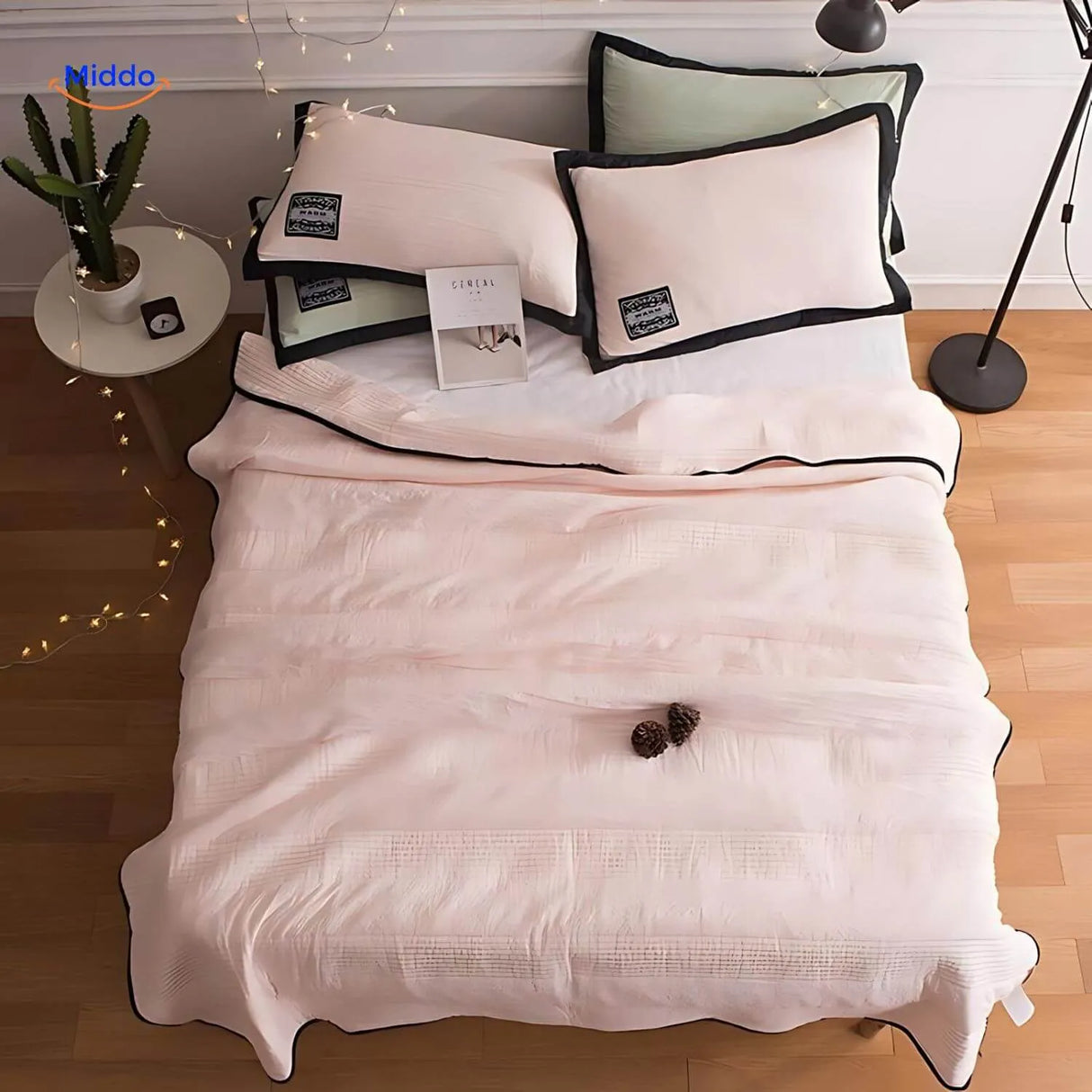 Cooling blanket in soft pink color offering breathable night comfort option.