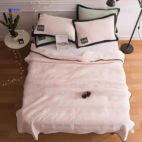 Cooling blanket in soft pink color offering breathable night comfort option.