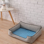 Blue cooling mat fitted inside dog basket for extra relief.