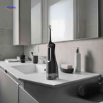 Modern cordless water flosser displayed on bathroom counter for daily oral care.
