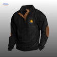 Black corduroy sweater with warm brown accent details.