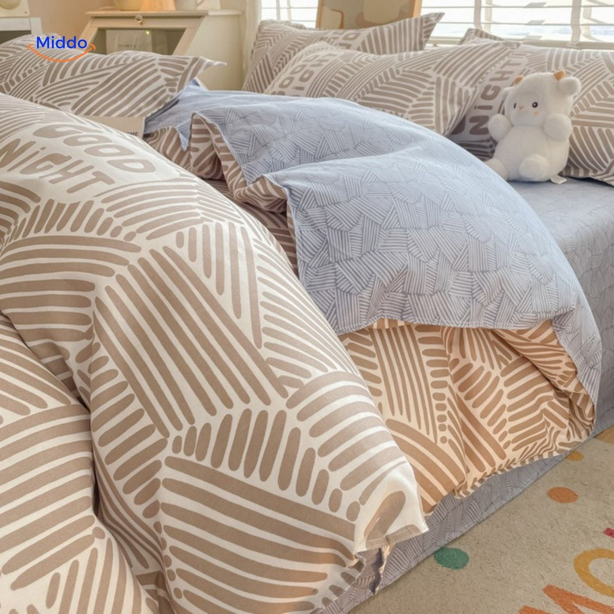 Neutral striped cotton bedding set, soft and versatile for any nursery decor.