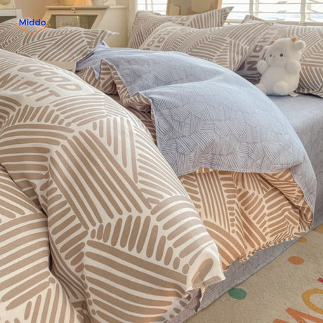 Neutral striped cotton bedding set, soft and versatile for any nursery decor.