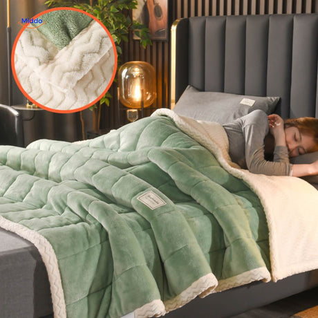 Green and white combination plush fleece blanket displayed.