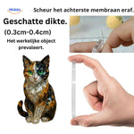 Crystal cat advent calendar held in hand showcasing compact gift box.