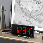 Curved LED digital alarm clock displayed on a modern desk with clean desk setup.