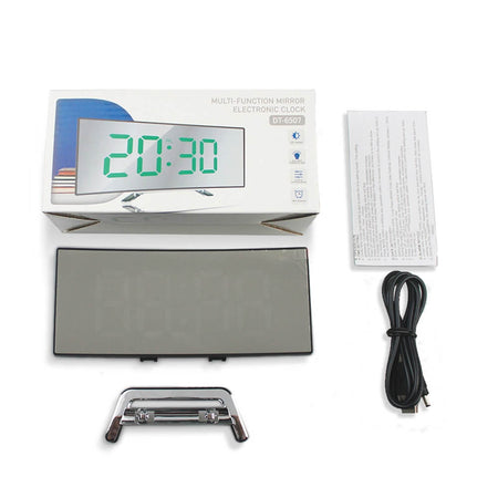 Package contents and unboxing of curved LED digital alarm clock with accessories.