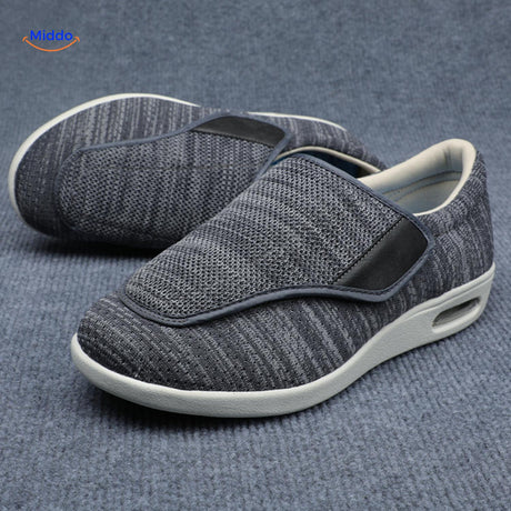 Dark gray therapeutic shoes with adjustable velcro band closure.