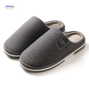 Close-up texture view of dark gray non-slip slippers.