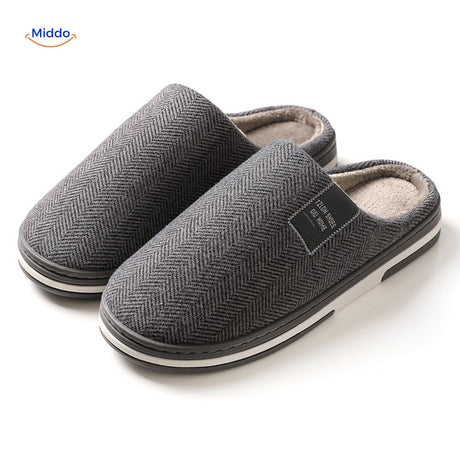 Close-up texture view of dark gray non-slip slippers.
