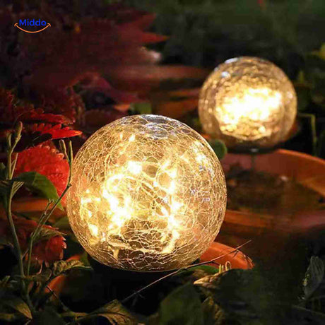 Decorative LED solar lamp nestled in flower pot planter lighting.