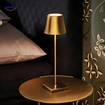 Dimmable LED lamp positioned on a nightstand beside a bed for ambient lighting.