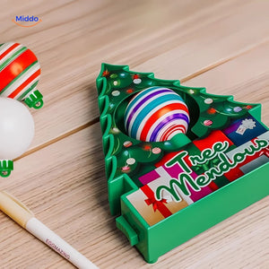 Painted wooden ornaments displayed on a table as finished holiday decoration pieces.