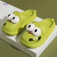 Green dog slippers featuring adorable cartoon dog face design.
