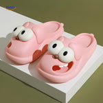 Pink cartoon dog slippers with cute expressive eyes and soft feel.