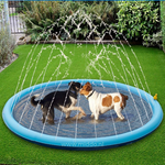 Multiple dogs enjoying sprinkler mat water activity outdoors