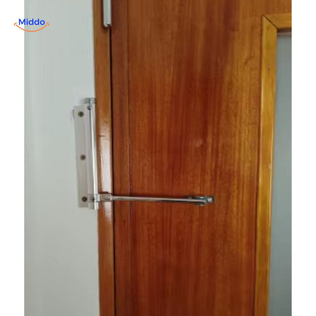 Door closer installation demonstration on wooden doors with hardware.