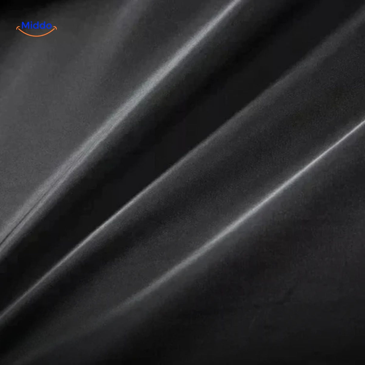 Close-up of the black wool coat fabric showing the dense, premium wool texture and weave.