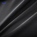 Close-up of the black wool coat fabric showing the dense, premium wool texture and weave.