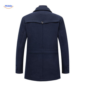 Back view of the dark navy double-collar wool coat showing the rear cut, seam, and hem.