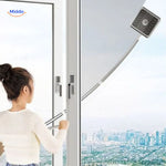 Double-sided magnetic window cleaner safely cleaning tall apartment building windows from indoors.
