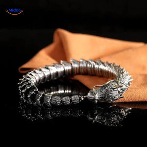 Dragon bone bracelet in silver rolled position showing metal shine and detailed craftsmanship.