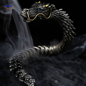Dragon bone bracelet emerging from smoke creating a dramatic and bold visual effect.