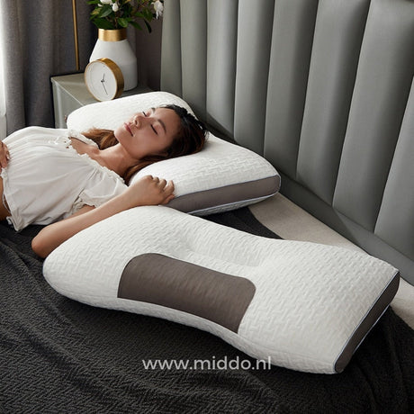 Ergonomic neck support pillow positioned for optimal sleeping comfort and support