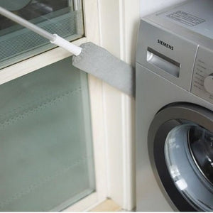 Extended duster cleaning dust from the side of washing machine.
