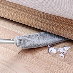 Extended duster cleaning dust from under bed and low furniture.