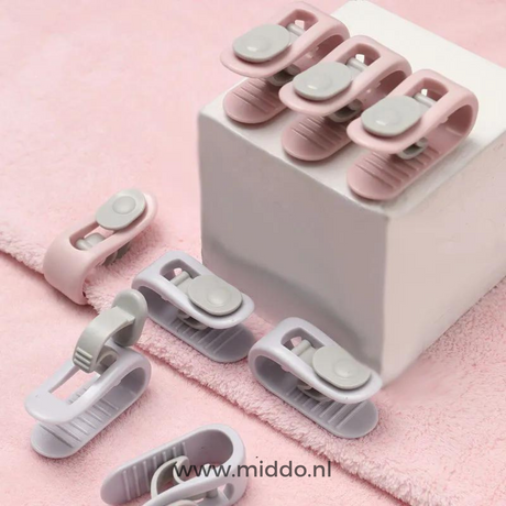 Close-up of duvet clips showing adjustable fastening mechanism
