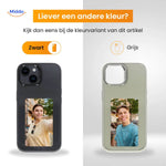 E-ink iPhone case in black showing a custom photo of a woman with her dog on the display.