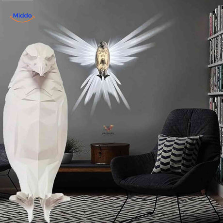 EagleGlow white eagle wall lamp illuminating cozy reading corner space.