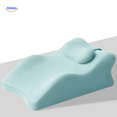 Blue leg elevation pillow with combined support for legs, head and neck comfort.